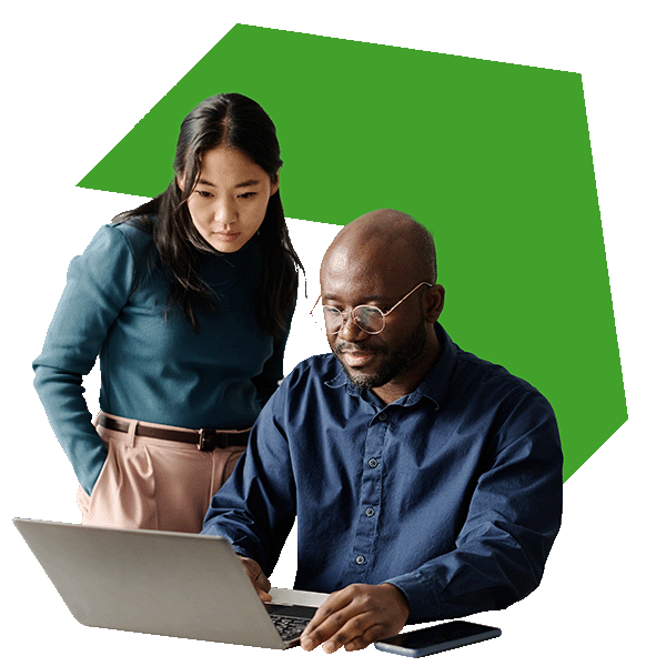 A woman and man colleague collaborating on a laptop with a green upright arrow behind them.
