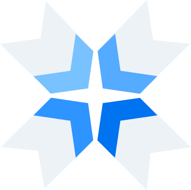 Four arrows coming together in 4 different shades of blue.
