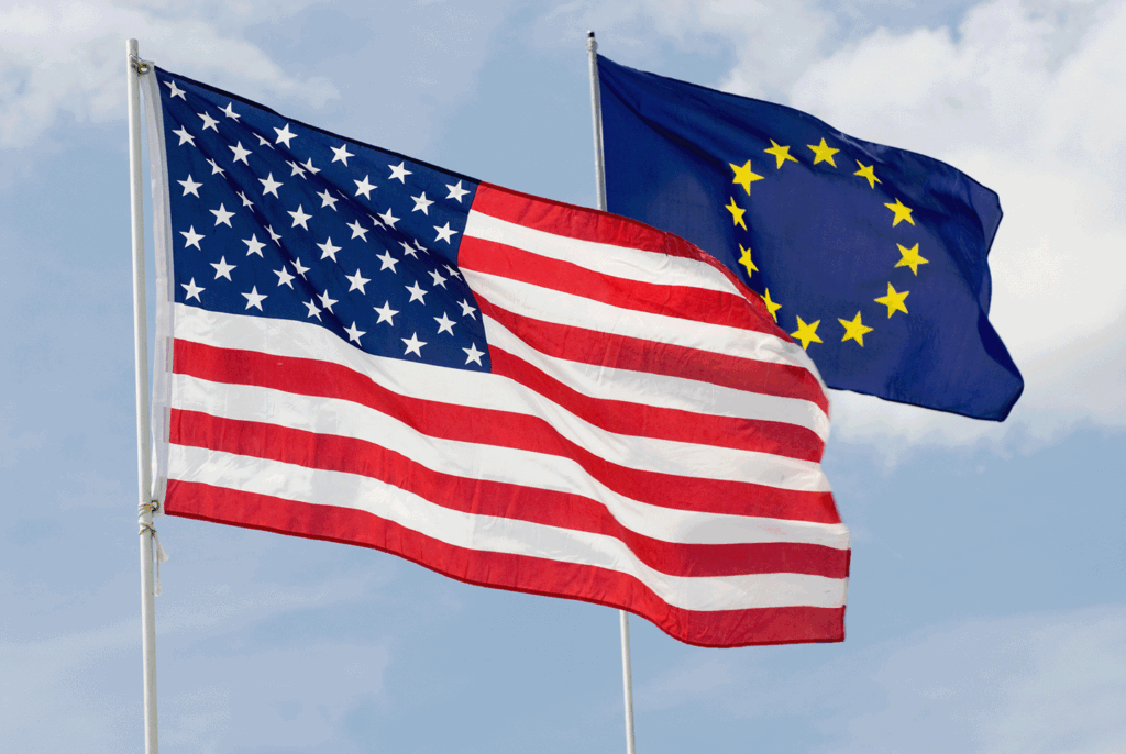The United States of America flag and the European Union flag bowing in the wind, representing the expertise in both countries.
